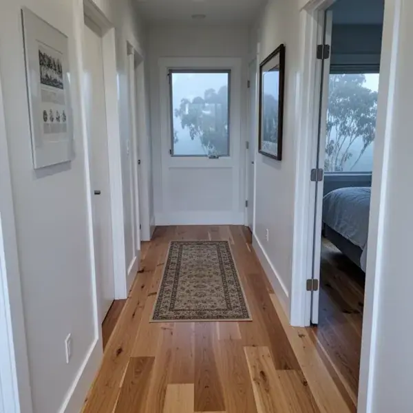 Spotless hallway and trim after the old floor went out Dust free finished engineered wood hallway in Makawao home