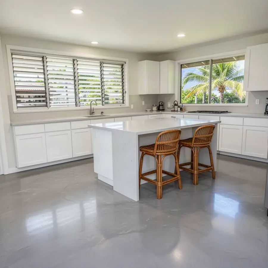 Seamless trowel-finish cement floor in a remodeled kitchen Gray microcement kitchen floor in Kihei condo remodel
