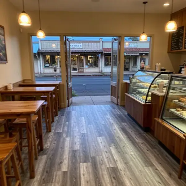 Gray vinyl plank floor finished in Paia cafe