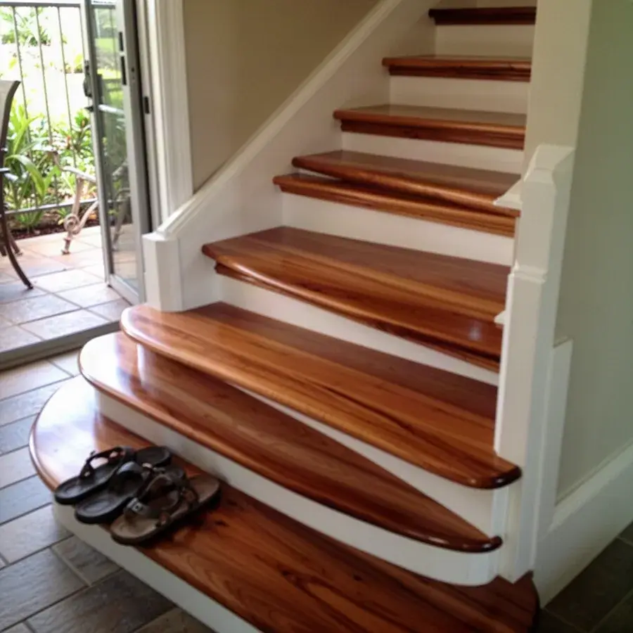 Close look at new treads, nosing and skirt board Hickory stair treads with bullnose edges in Wailea townhouse