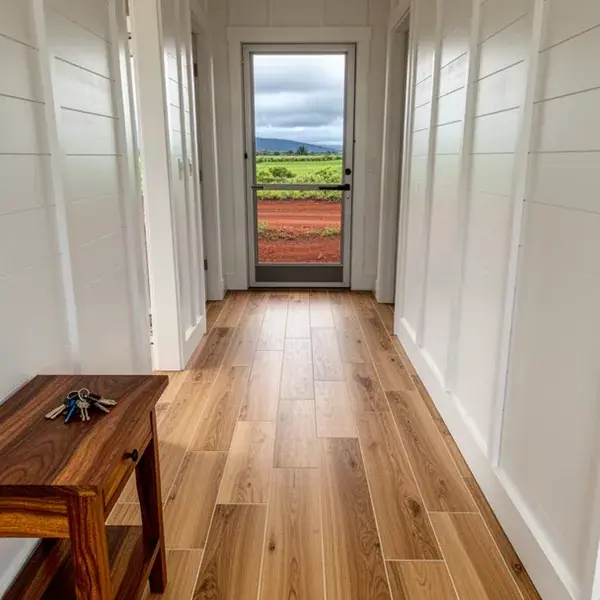 Porcelain planks that pass for hardwood Wood-look porcelain plank floor in Haliimaile home hallway